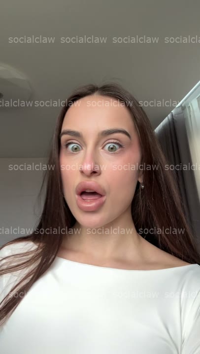 wide-eyed hand-over-mouth gasp