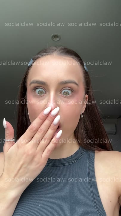 wide-eyed hand-over-mouth shock
