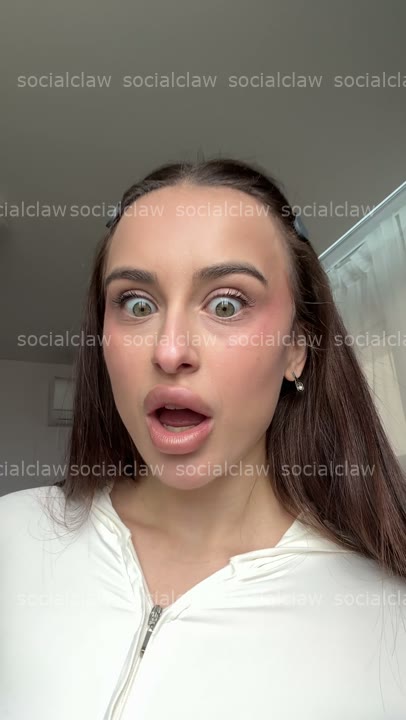 wide-eyed hand-over-mouth gasp